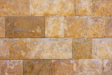 Fototapeta premium Wall of orange stone brick