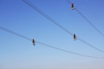 Overhead power line during construction, and workers team