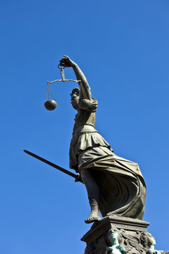 Statue of Lady Justice "Justitia" in front of the Romer in Frank