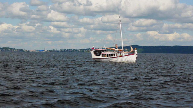 Sailboat in regatta on blue sea
