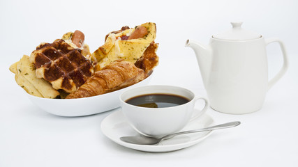 Assorted baked bread and coffee