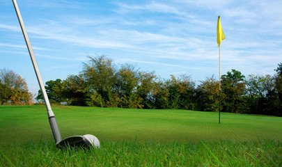 chipping a golf ball onto the green