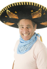 middle age senior tourist male wearing Mexican somebrero hat cow