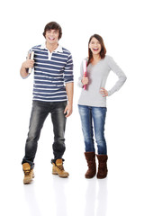 Fototapeta premium Young woman and man standing with books