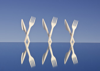 white plastic flatware on mirror