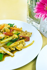 Stir fry chicken and chili in oil