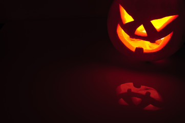 Glowing pumpkin with a candle inside