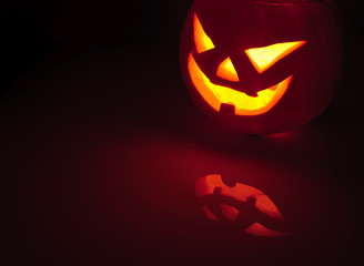 Glowing pumpkin with a candle inside