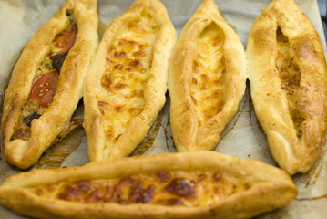 Turkish food pide, yeast dough cheese and butter.