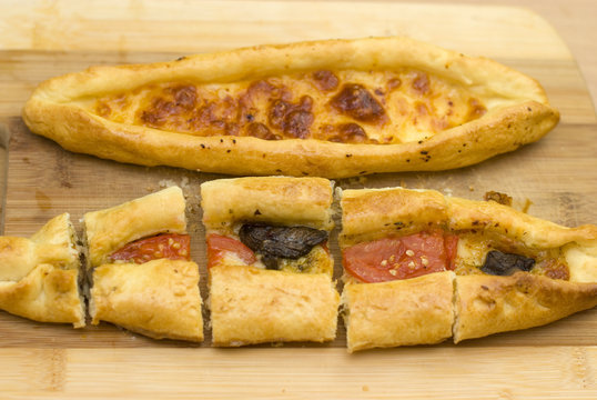 Turkish food pide, yeast dough cheese and butter.