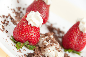 Appetizing fresh strawberries with cream
