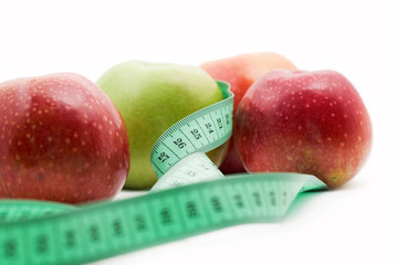 measuring tape and apple