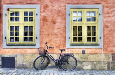 Fototapeta na wymiar Old bicycle on a cobblestone street.