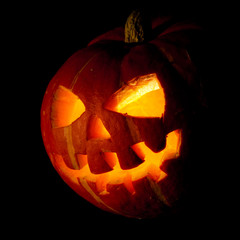 halloween, old jack-o-lantern on black