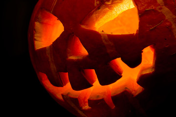 halloween, old jack-o-lantern on black