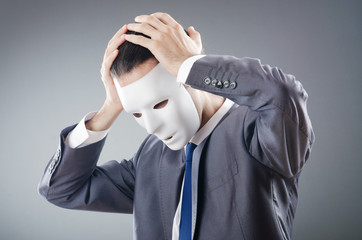 Industrial espionate concept with masked businessman