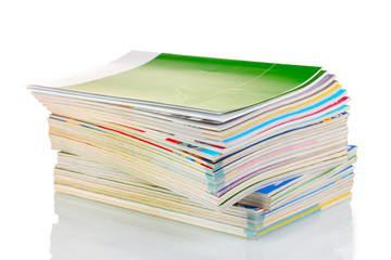Stack of magazines isolated on white