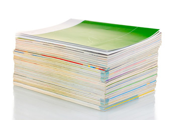Stack of magazines isolated on white