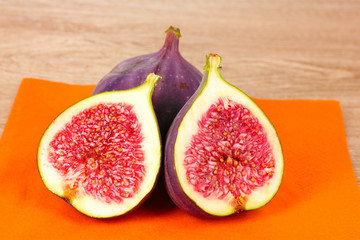 Ripe figs on wooden background