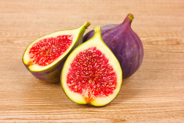 Ripe figs on wooden background