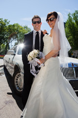 Newly wed couple in sunglasses