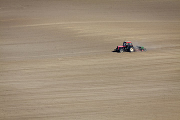 Tractor on dusty Field isolated
