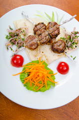 Meat cuisine - kebab served in plate