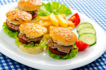Plate with tasty mini burgers