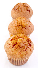 golden muffins close up isolate on white background