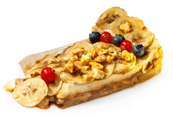 Banana dessert with nuts and berries