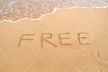 Free text written on the beach sand
