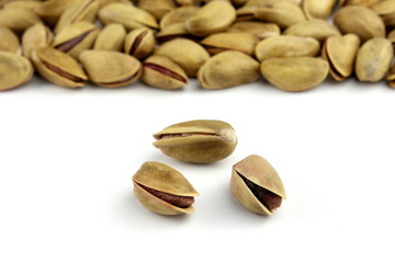 Pistachio nuts on white