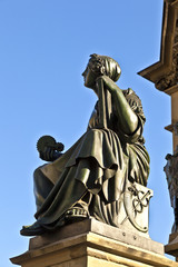 allegory at statue of Johannes Gutenberg