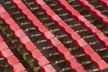 Lecce (Puglia, Italy): red empty chairs in the Roman theatre