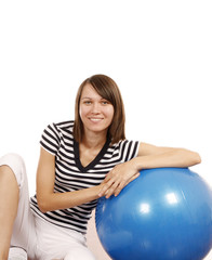 Young woman with gym ball