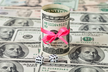 Fototapeta premium Two dices on money background - business concept