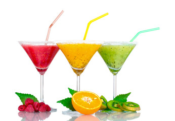 Delicious fruit smoothies and fruit isolated on white