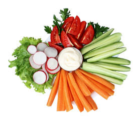 Chopped vegetables and sauce on plate isolated on white