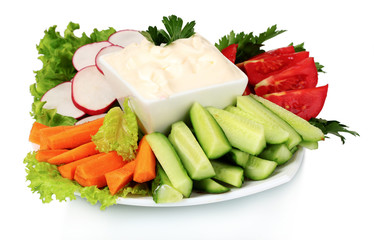 Chopped vegetables and sauce on plate isolated on white