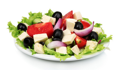 Tasty greek salad on plate isolated on white