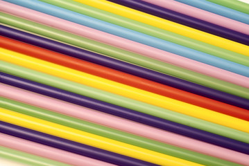 Many-coloured straws as a background
