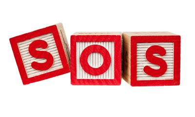 Wooden blocks forming the letters SOS isolated