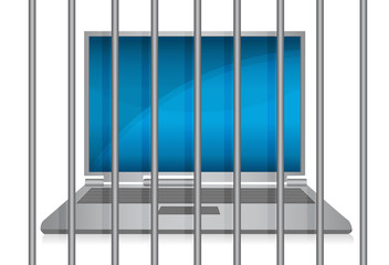 laptop behind bars. online crime concept