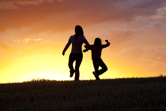 Mother And Daughter Dancing.