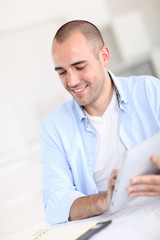 Fototapeta premium Office worker using electronic tablet