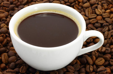 Cup of coffee with coffee beans