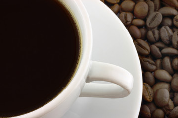 Cup of coffee with coffee beans