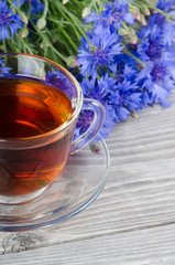 Glass cup with a cornflower tea