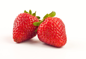 Two fresh strawberries isolated on white background