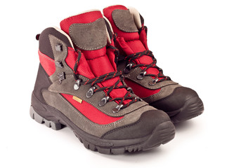 New trekking boots on white background
